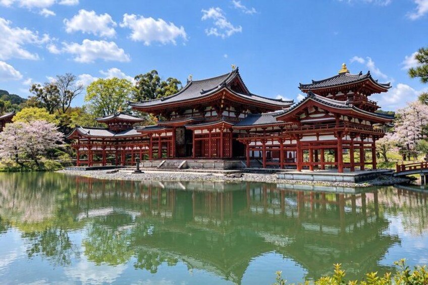 A traditional Japanese temple with a pond in front. 3