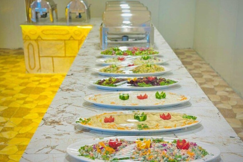 A buffet table with various dishes. 3