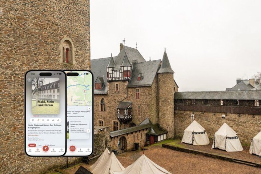 A historic building with a stone facade and a large tower. 1