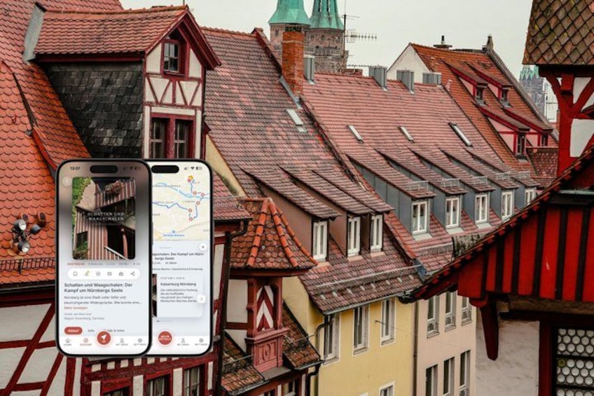 A smartphone displaying a map with a red route, traditional European buildings, and a church steeple. 1