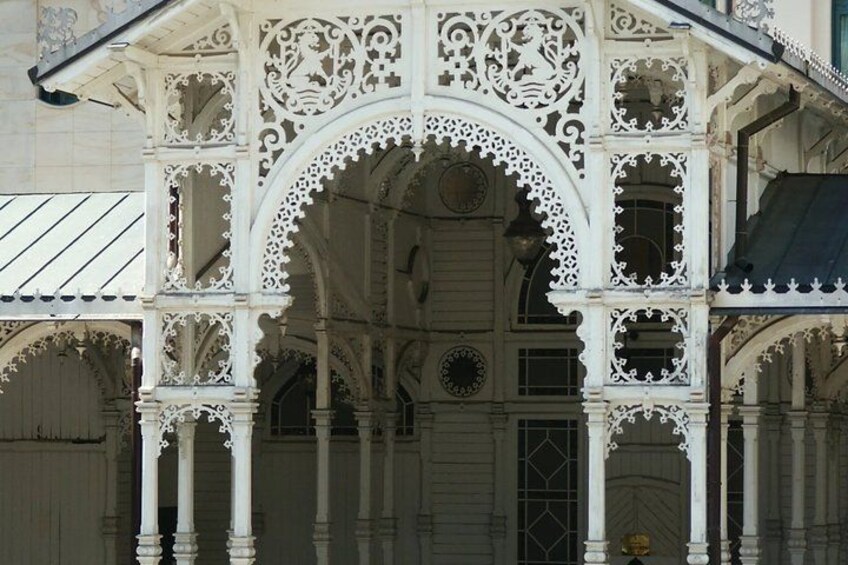 Ornate white architectural details with arches and columns. 4