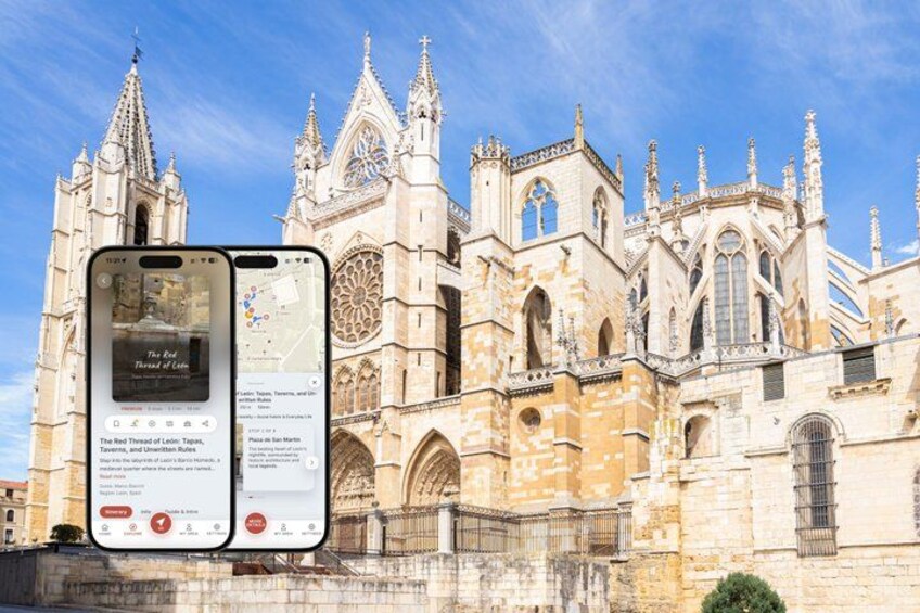 A historic cathedral with intricate architecture, a smartphone displaying a map, and a clear blue sky. 1