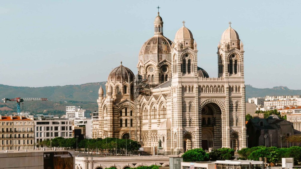 A large, ornate cathedral with multiple domes and a clock tower. 5