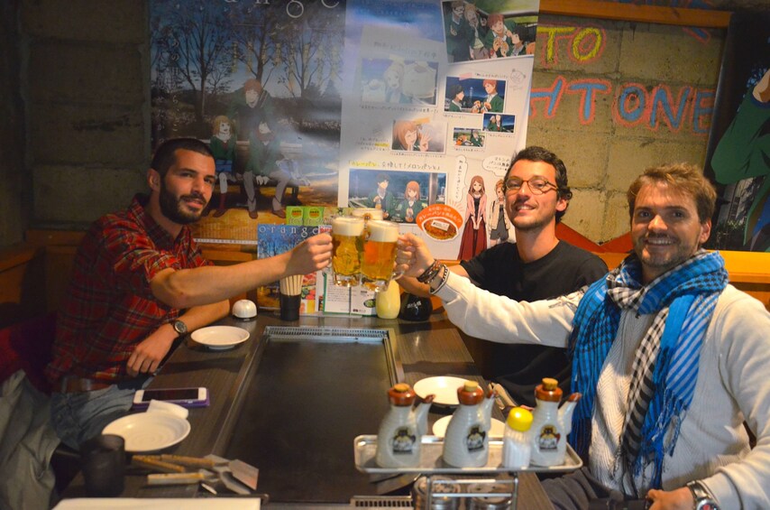 Three people at a restaurant in Osaka