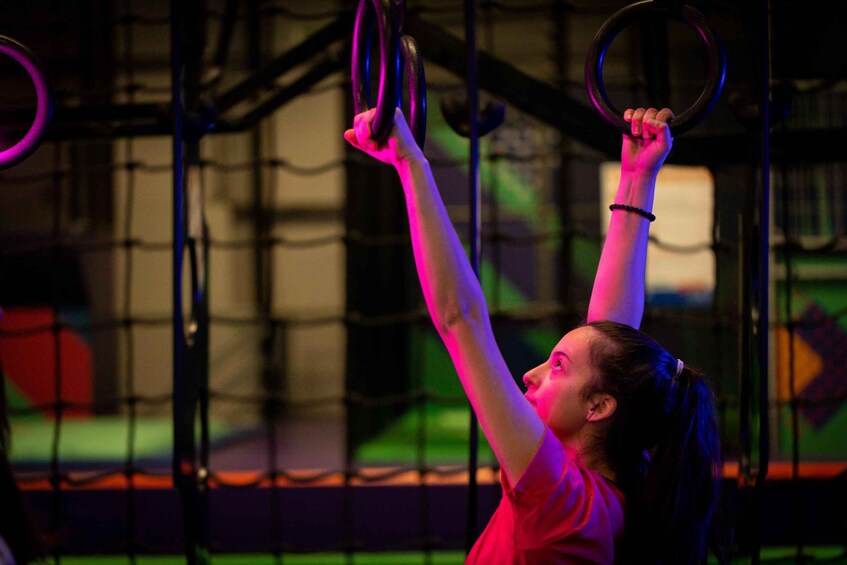 A person performing an exercise with gymnastic rings. 3