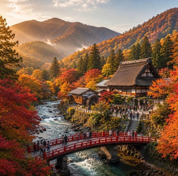 Un edificio japonés tradicional con techo de paja, rodeado de árboles de colores otoñales y un río caudaloso. 2