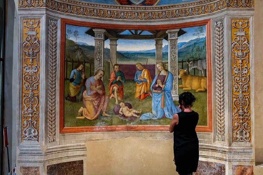 A fresco mural with figures, architectural columns, and a landscape background. 2