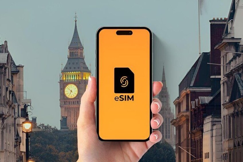 A hand holding a smartphone with the eSIM logo, with the Big Ben clock tower in the background. 1