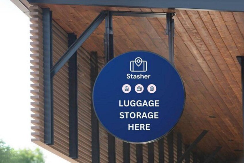 A blue sign with white text indicating a luggage storage area, with a logo and icons for services. 2