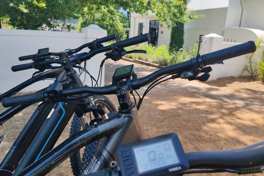 A bicycle with a digital display, handlebars, and a front wheel. 5