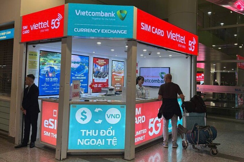 A currency exchange booth with a 5G SIM card service. 2