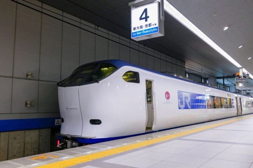 A high-speed train at a station platform. 2