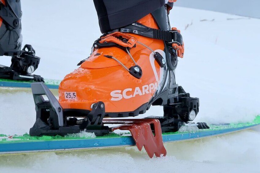 A snowmobile with the brand name 'SCARPA' and model number '25.5' on its side. 3