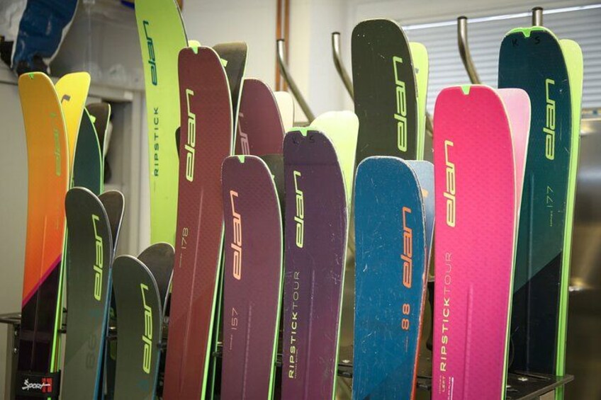 A collection of colorful skis with the brand name 'LEP' visible on them. 1