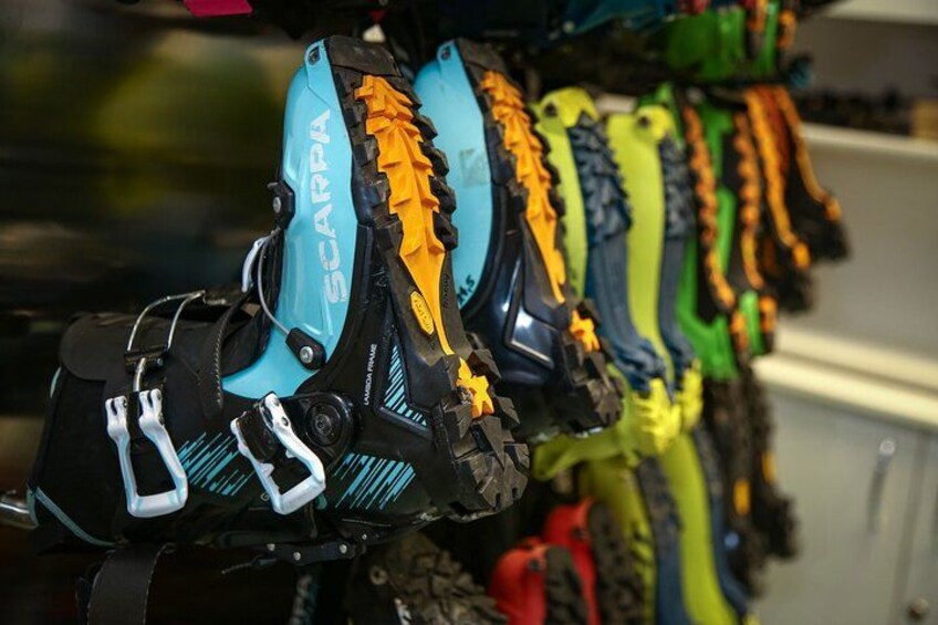 A row of colorful mountain bike tires with the brand name 'SCARPA' visible on them. 2