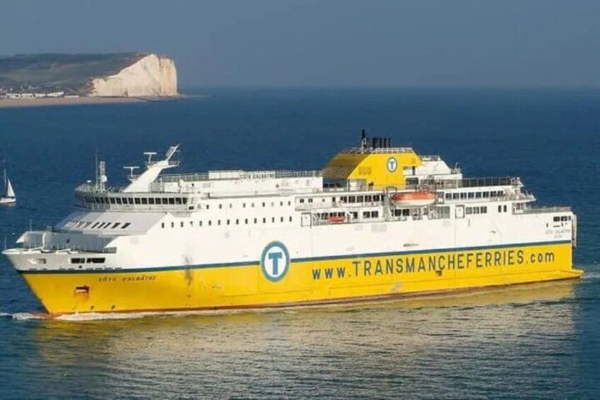 A large ferry with a yellow and white color scheme, a website URL, and a logo on its side. 1
