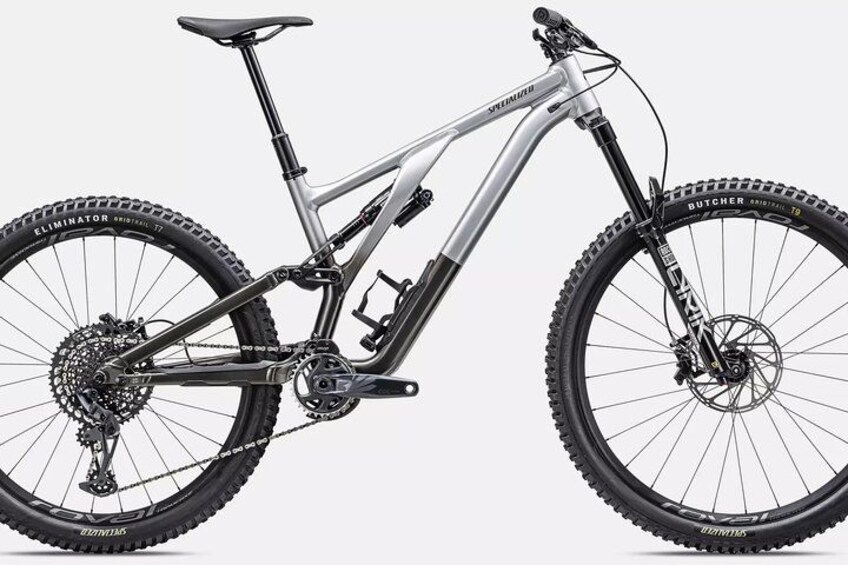 A mountain bike with a front suspension fork, disc brakes, and a rear derailleur. 2