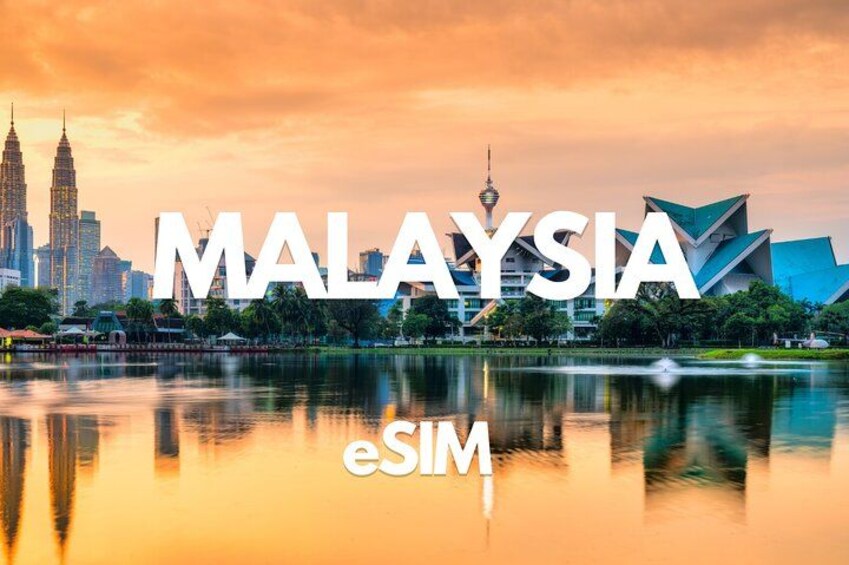 A cityscape with the Petronas Twin Towers and a modern building reflecting in a body of water. 1
