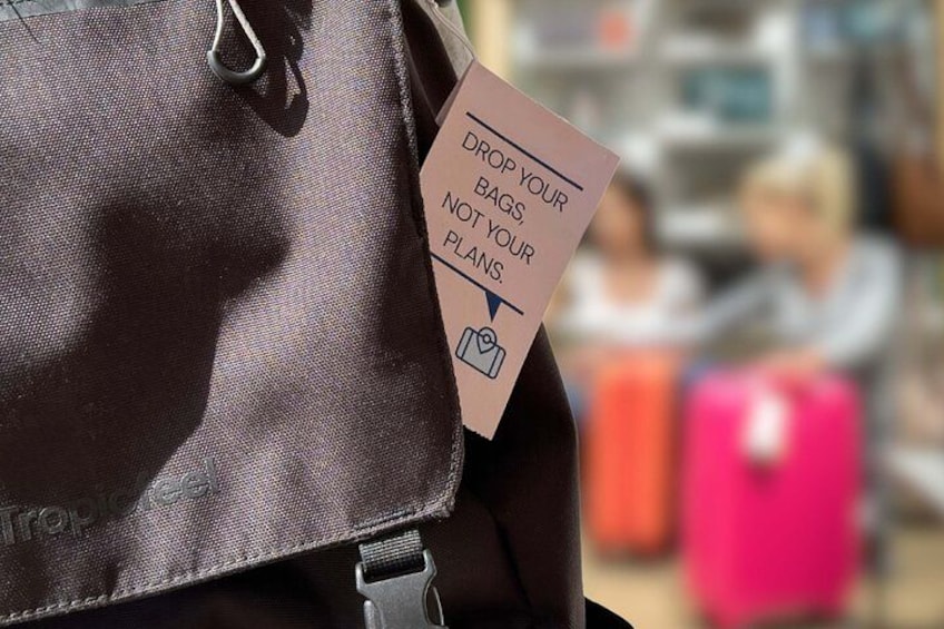 A brown bag with a tag instructing to drop bags, not plans. 5