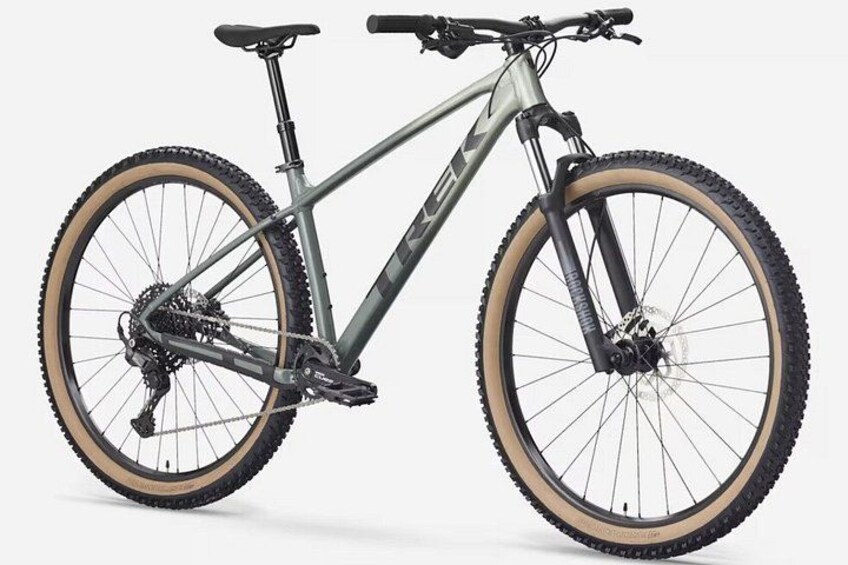 A mountain bike with a front suspension fork, a gear shifter, and a rear derailleur. 1