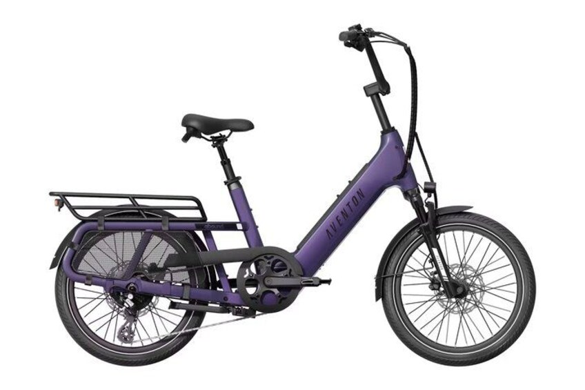 A purple electric bicycle with a front basket and a rear rack. 3