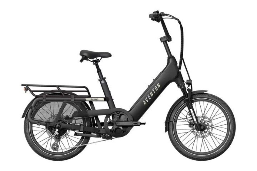 A black electric bicycle with a front basket and a rear rack. 2