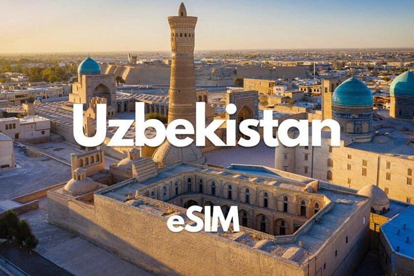 A historic building with domes and a minaret in Uzbekistan. 1