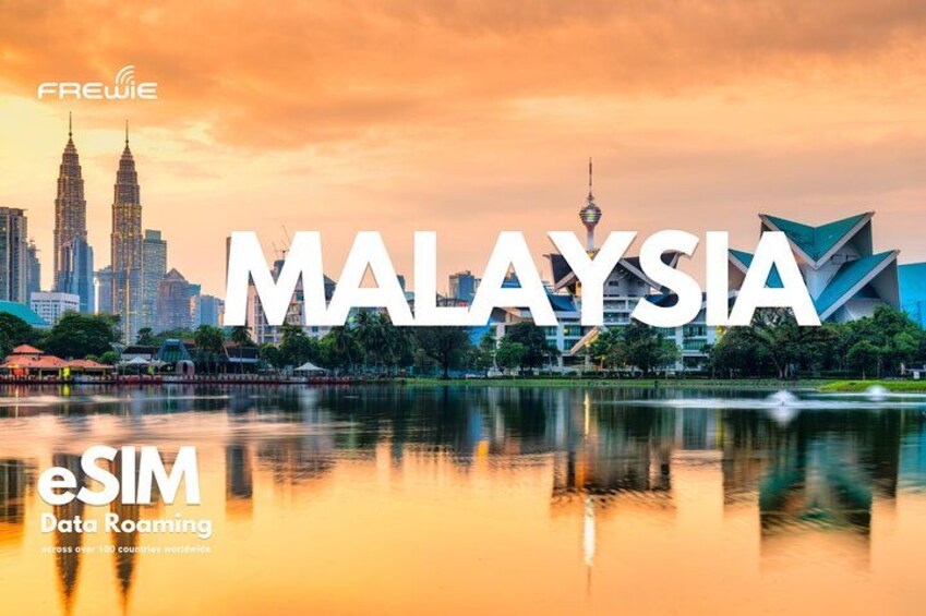 Kuala Lumpur's skyline with the Petronas Twin Towers and a modern building reflecting on a calm river. 1