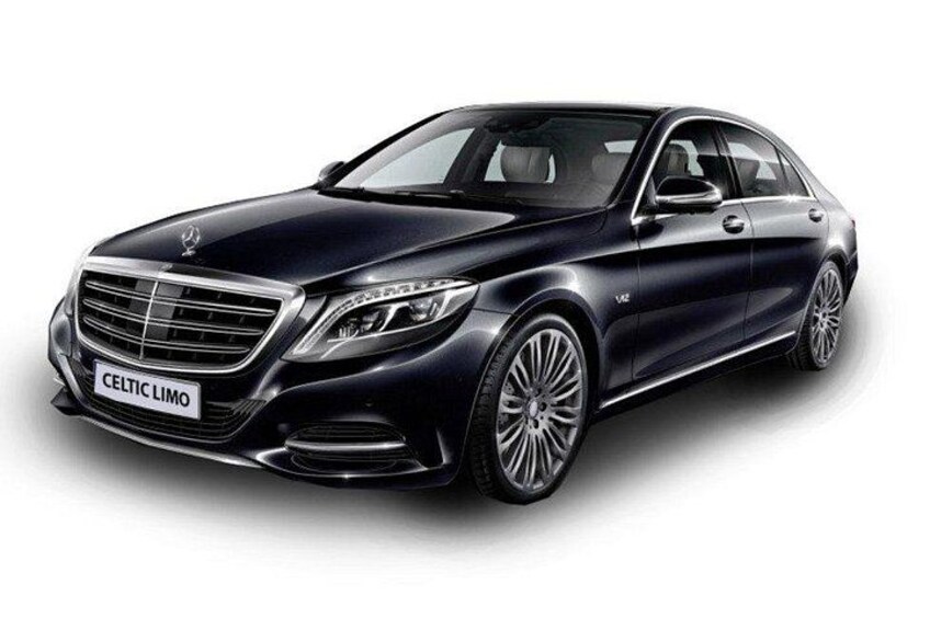 A black luxury car with a sleek design and a prominent front grille. 2