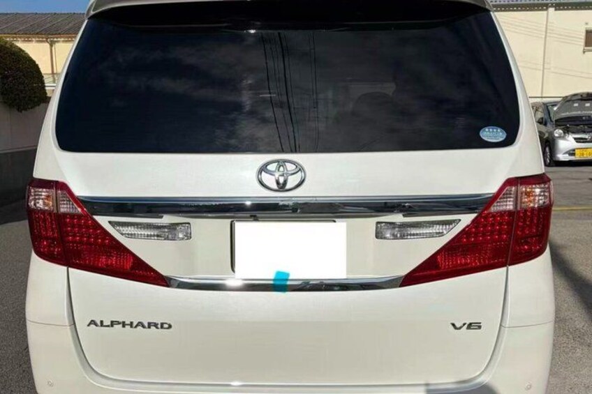 The rear of a white Toyota ALPHARD V6. 5