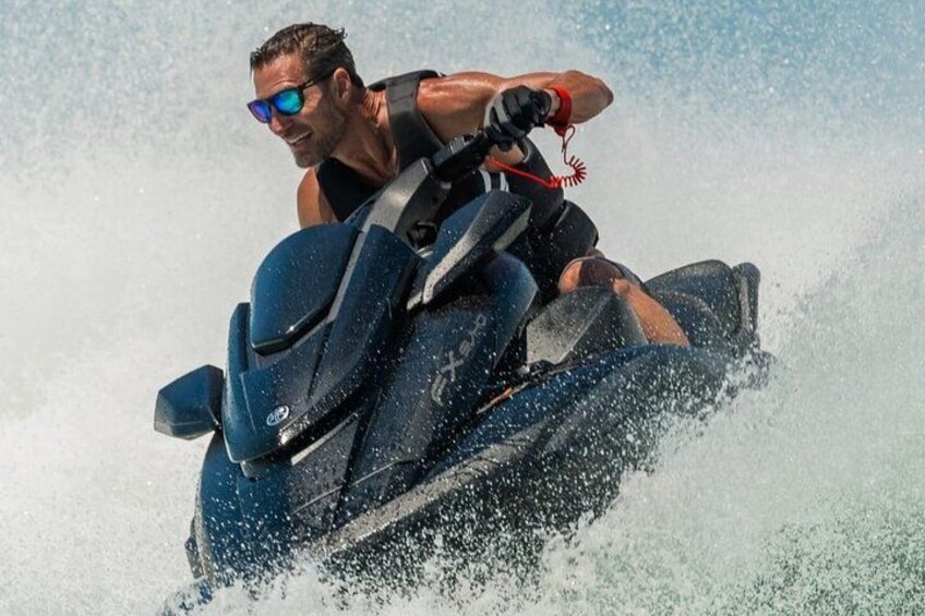 A person riding a jet ski on water. 4