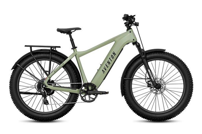 A mountain bike with a green frame, black tires, and a rear rack. 3