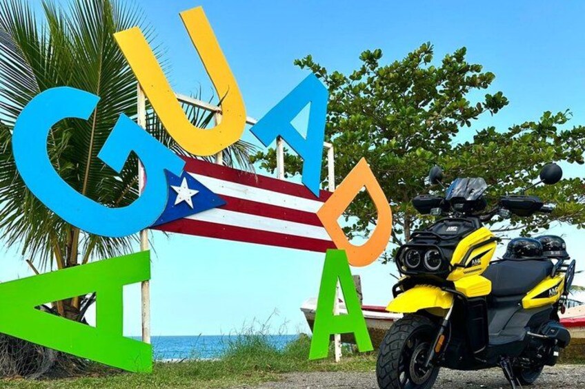 A motorcycle, colorful letters spelling 'CUBA,' and a palm tree. 4