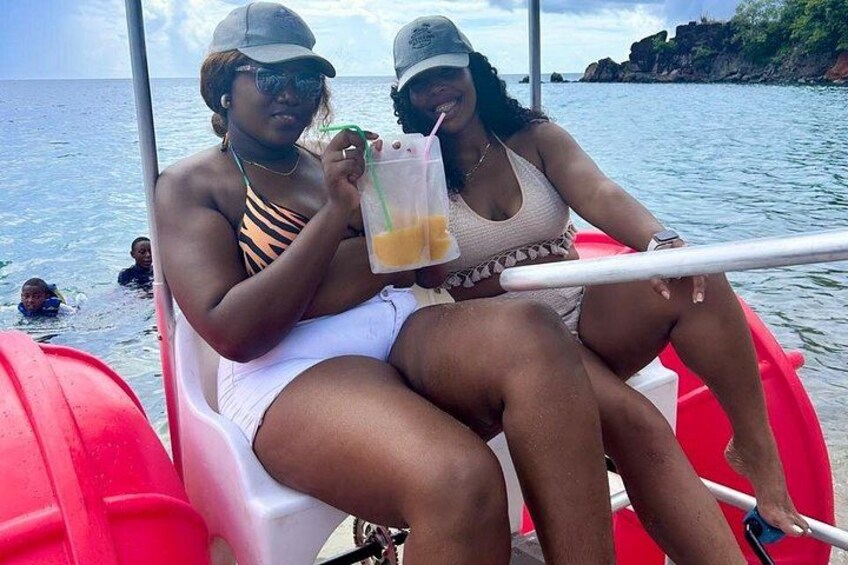 Two people on a boat with a drink. 3