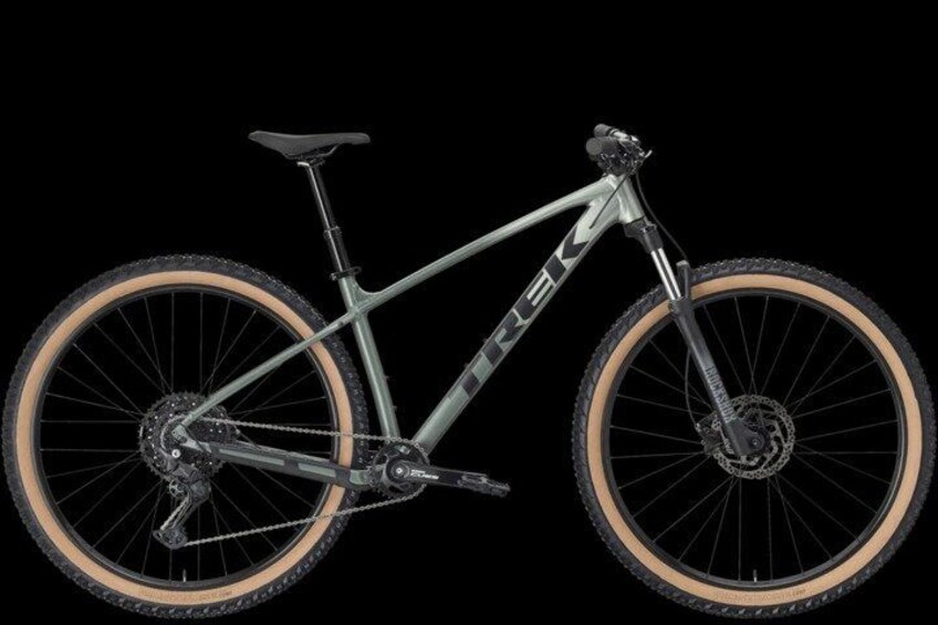 A mountain bike with a front suspension fork, a rear derailleur, and a chainring. 2