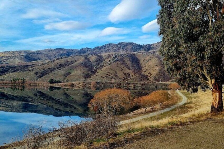 A lake, a winding road, and a mountain range. 5