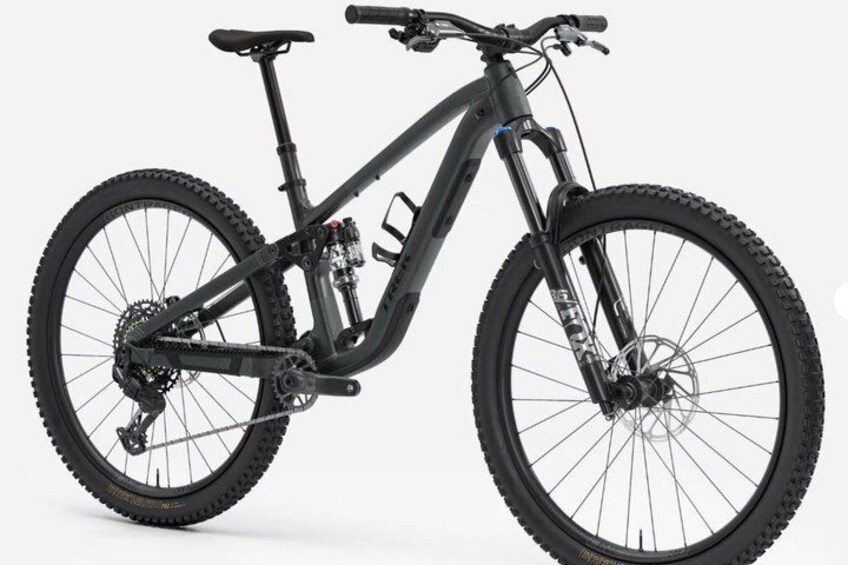 A black mountain bike with a front suspension fork, a step-through frame, and disc brakes. 1