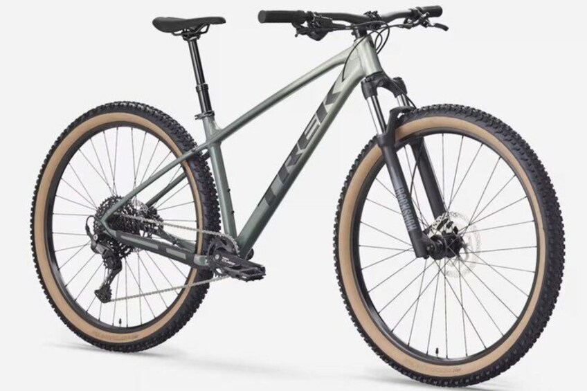 A mountain bike with a front suspension fork, a rear derailleur, and a chainring. 1