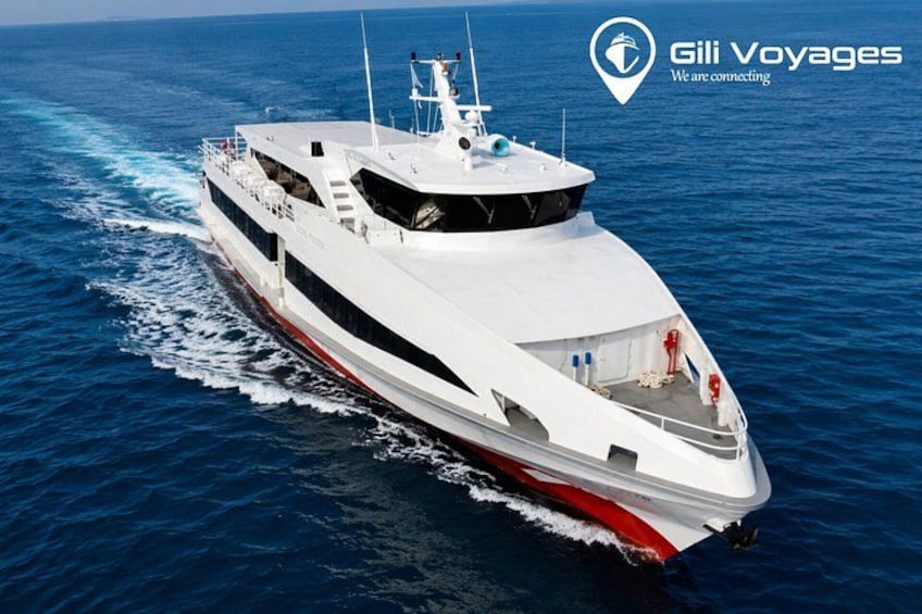 A large white yacht with a red stripe, moving through the ocean. 1