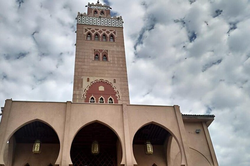A tower with arched windows and a minaret. 4