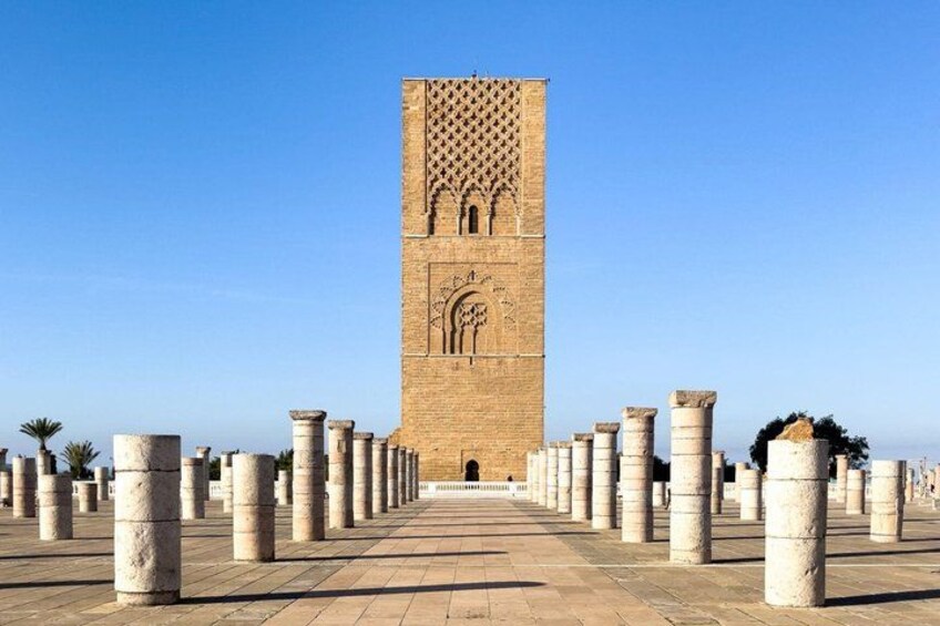 A large tower with intricate carvings, surrounded by a series of columns. 5