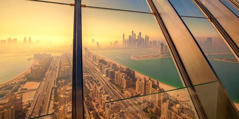 A cityscape with a prominent skyline, a coastline, and a large body of water. 5