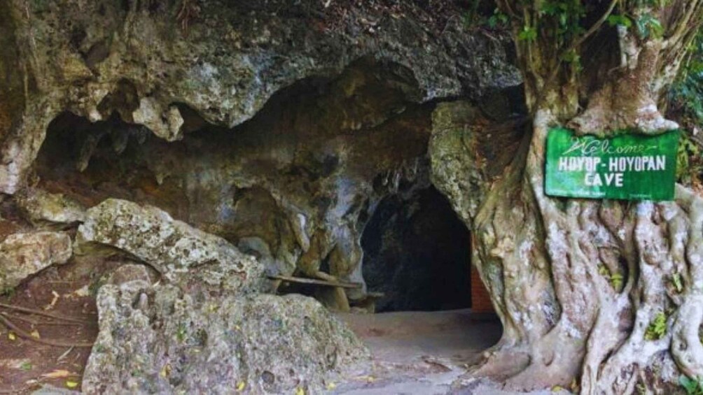 A cave entrance with a sign reading 'Hoyop-Hoyopan Cave'. 4