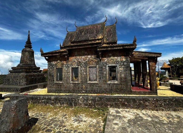 A traditional temple with a multi-tiered roof and ornate decorations. 3