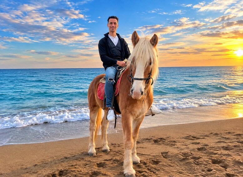 A person riding a horse on a beach at sunset. 1