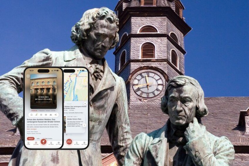 A statue of two historical figures in front of a clock tower. 1