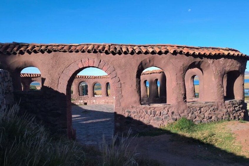 A historical building with arches and a tiled roof. 3