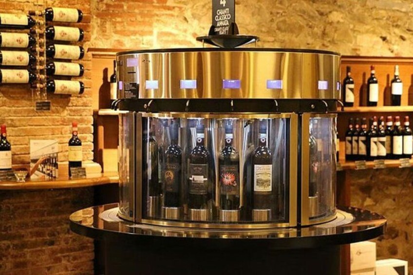 A wine rack with bottles, a wine cooler, and a brick wall. 5