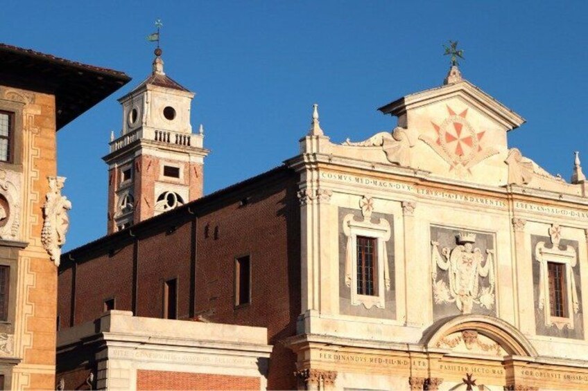A historic building with a clock tower and ornate facade. 2