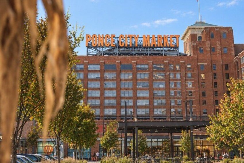 A large brick building with a sign reading 'Ponce City Market.' 5